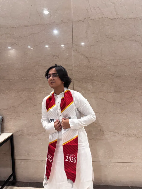 Aditya at graduation, wearing the NMIMS Class of 2026 stole